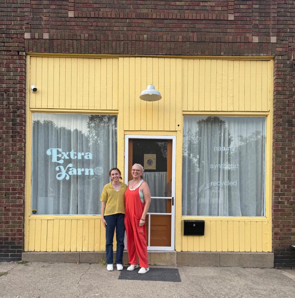 Denise and Shelby standing outside of Extra Yarn on opening day.
